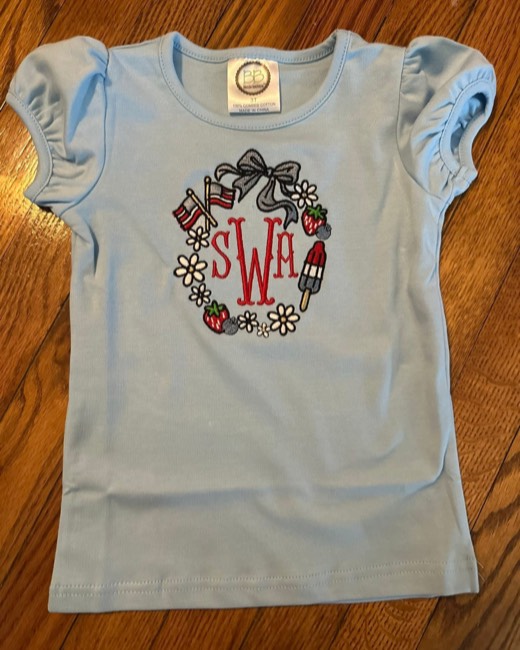 Patriotic monogram wreath stitched on a toddler top
