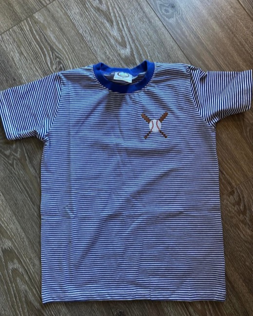Baseball and crossed bats stitched on a striped tee